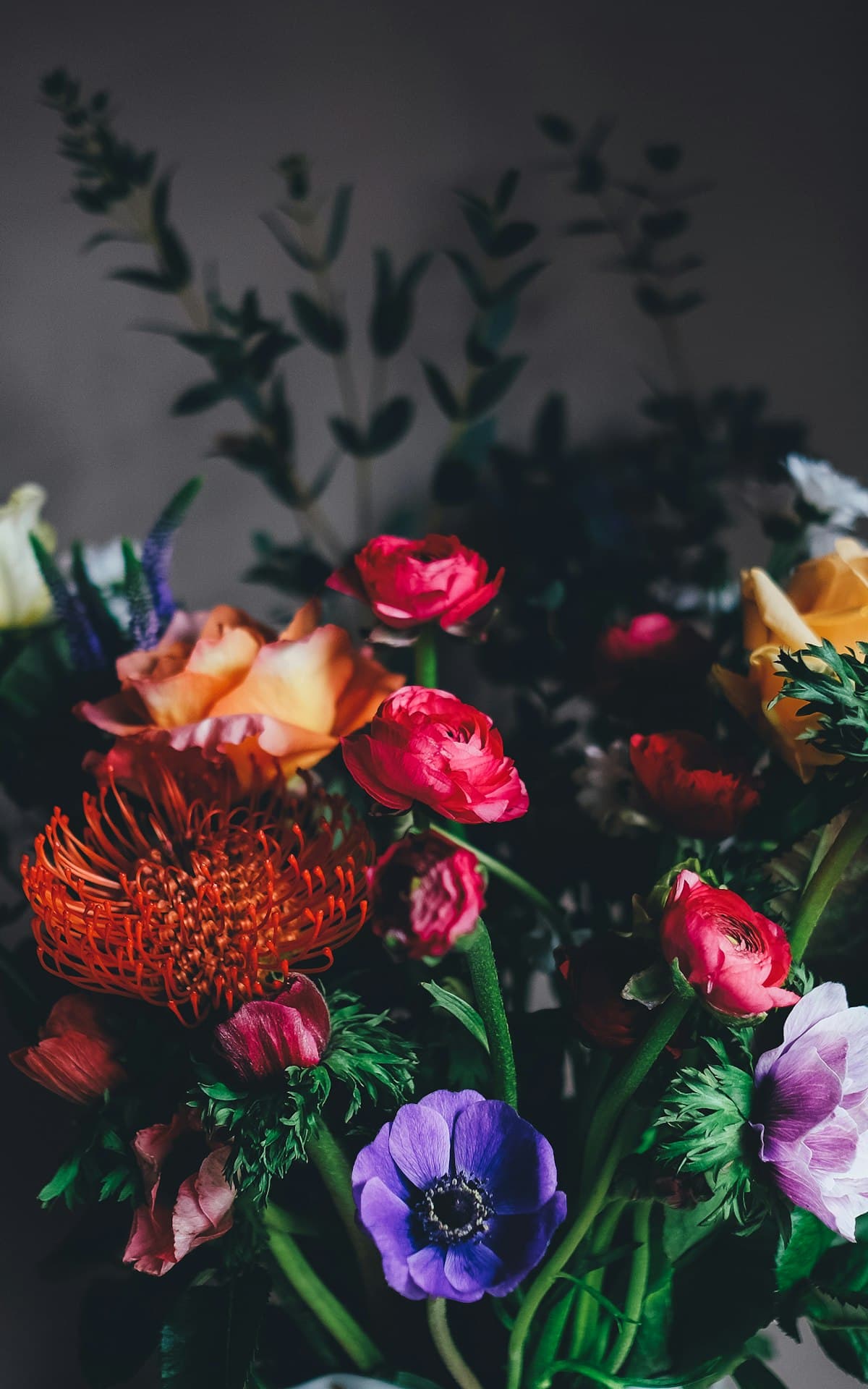 Handpicked ranunculus, anemones, and protea